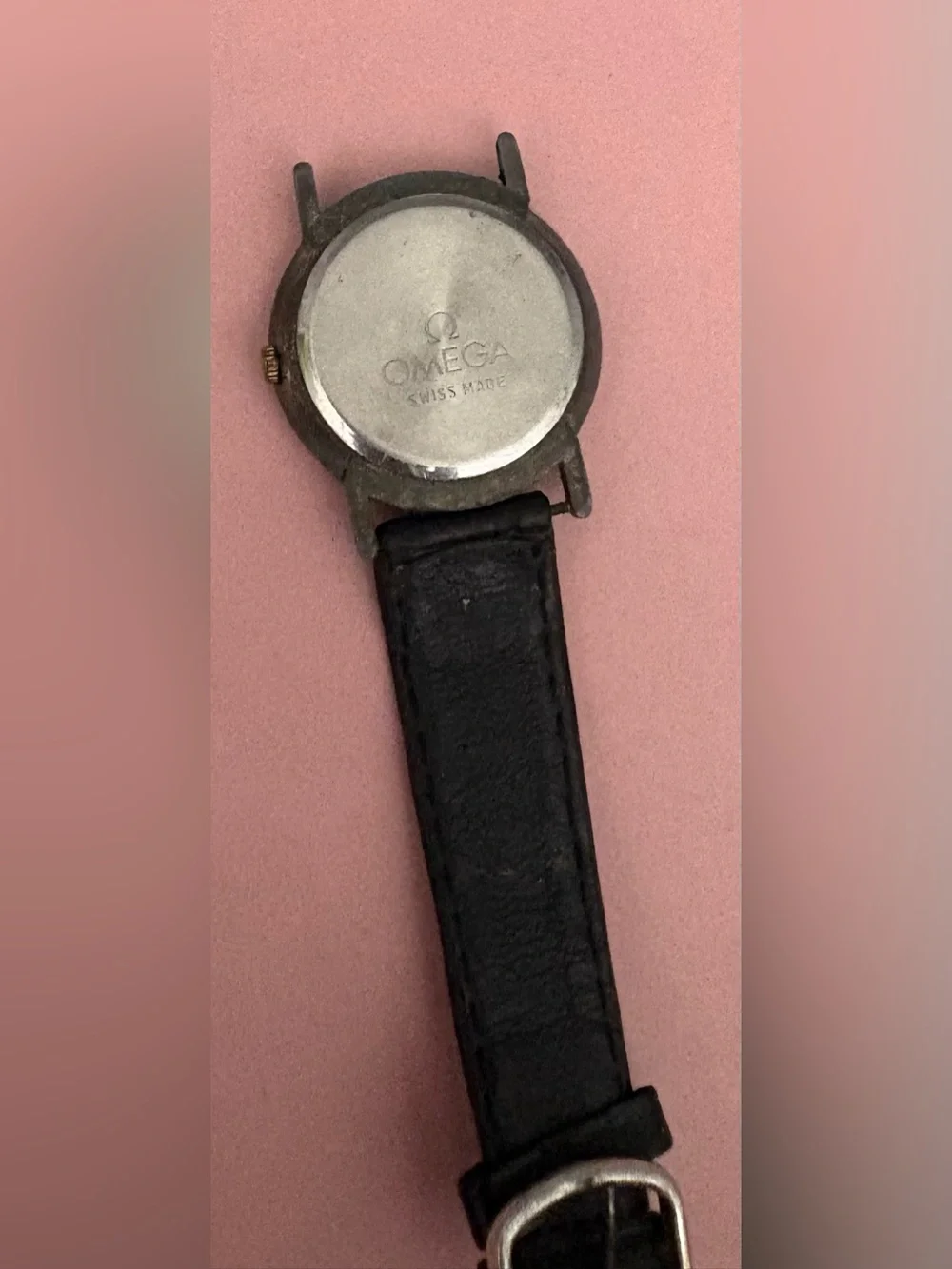 Omega Black Dial Watch with Gold Accents and Crystal Markers